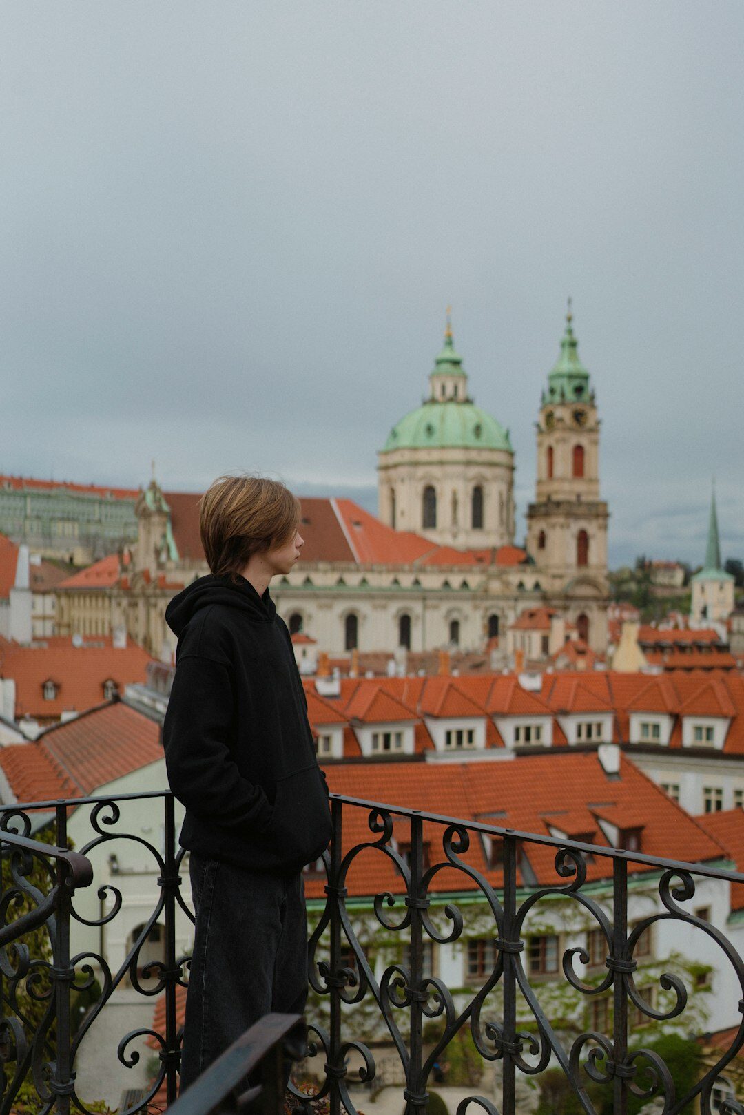 Portrait of a Czech woman in her fifties, gardening editor, smiling outdoors